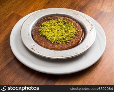 Traditional Turkish Dessert Kunefe served with pistachio