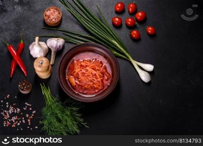 Traditional Ukrainian borscht, bowl of red beet root soup borsch. Traditional Ukrainian borscht with beets, tomatoes, garlic, sπces and herbs. Ukrainian dish, traditional food
