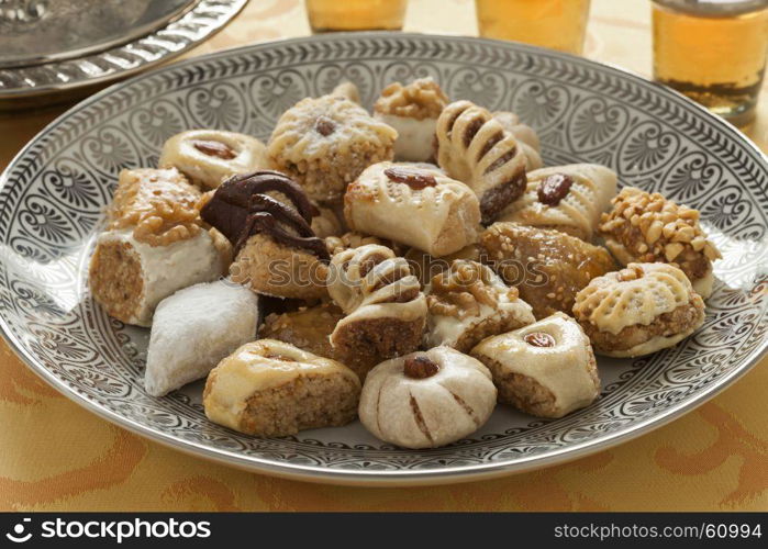 Traditional variety of festive Moroccan cookies and mint tea