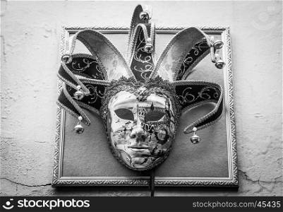 Traditional Venetian Mask on old wall background