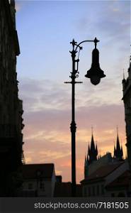 Traditional vintage street lamp and architecture of beautiful Prague in the evening