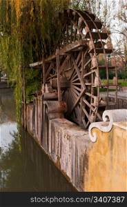 traditional watermill structure surrounded by trees in Tomar, Portugal