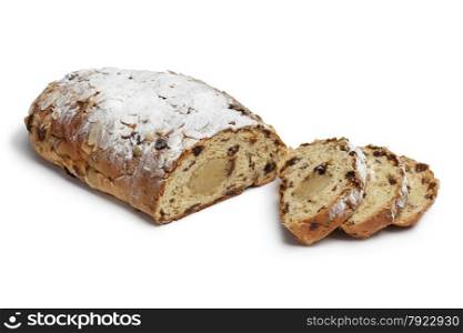 Traditional whole dutch easter bread covered with sugar and filled with almond paste on white background