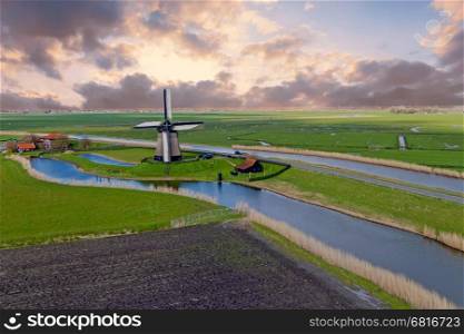Traditional windmill in a dutch landscape in the Netherlands