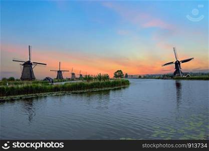 Traditional windmills at Kinderdijk in the Netherlands at sunset