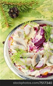 Traditional winter salad with beets and herring.Food for Christmas. Beetroot and herring salad
