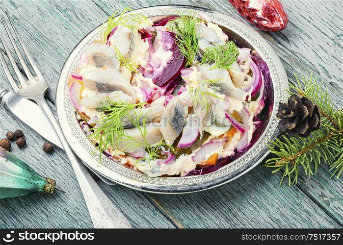 Traditional winter salad with beets and herring.Food for Christmas. Beetroot and herring salad