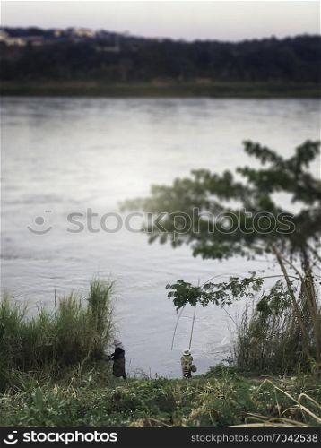 Traditional women fisherman beside the river, stock photo