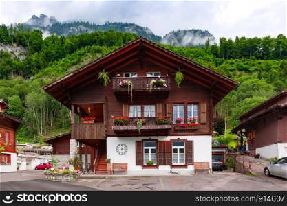 Traditional wood house in swiss village Iseltwald, Switzerland. Swiss village Iseltwald, Switzerland