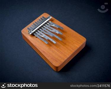 Traditional wooden kalimba isolated on black background. Traditional wooden kalimba isolated on black