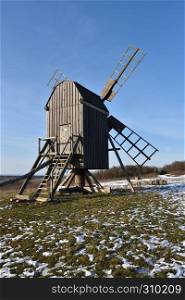 Traditional wooden windmill at the swedish island Oland in winter season