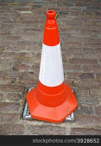 Traffic cone. Orange and white traffic cone for roadworks