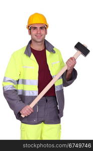 Traffic guard holding a mallet