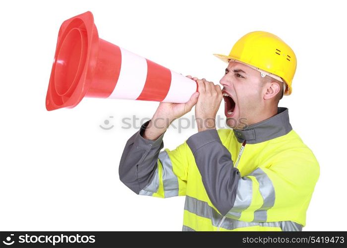 Traffic guard screaming into a pylon