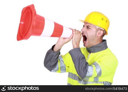 Traffic guard screaming into a pylon