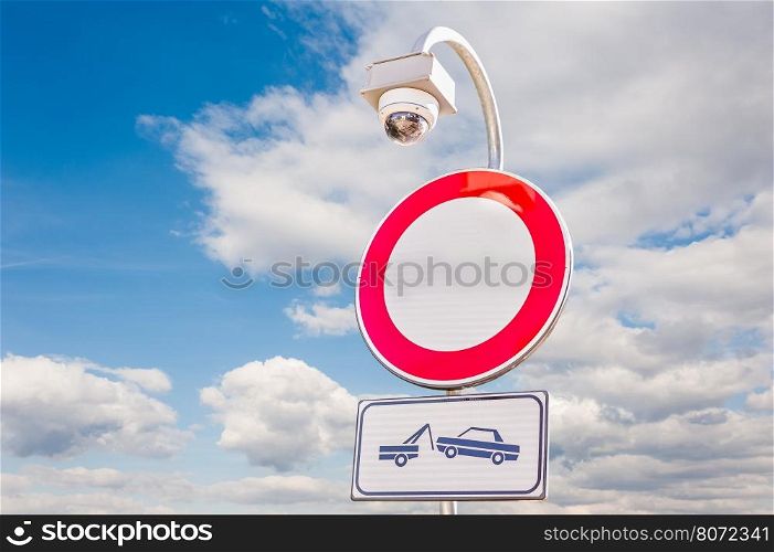 traffic is prohibited, road sign , with forced removal sign and car surveillance camera,CCTV