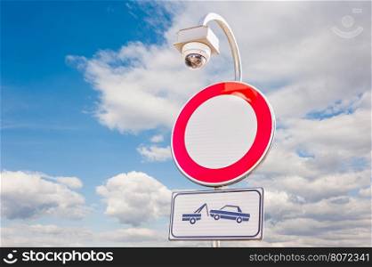 traffic is prohibited, road sign , with forced removal sign and car surveillance camera,CCTV