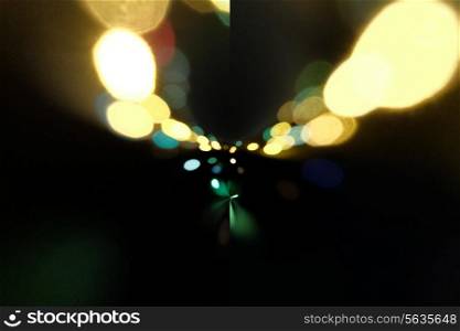Traffic lights in the background with blurring spots of light, copyspace