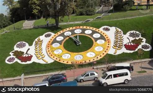 traffic near famous large floral clock at center Kiev, Ukraine, it consists of 80 thousand flowers