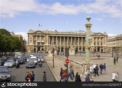 Traffic on a road in front of a hotel, Hotel Crillon, Paris, France