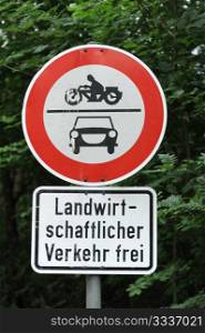 traffic sign cars and motorbikes forbidden, only agricultural vehicles