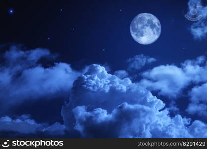 Tragic night sky with a full moon and shining stars