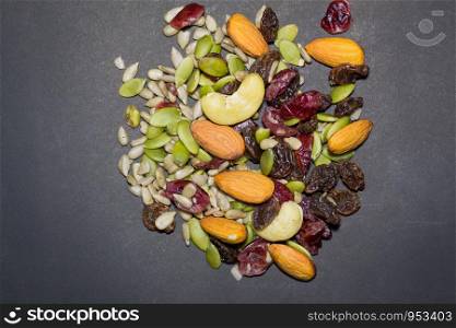 Trail mix on the black background. Trail mix background.
