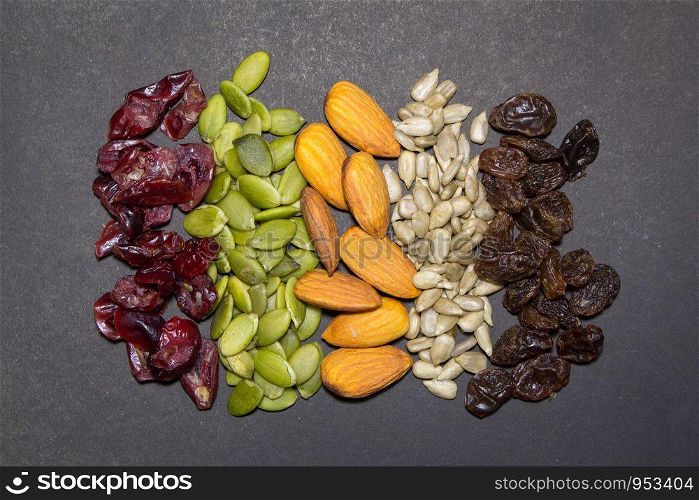 Trail mix on the black background. Trail mix background.