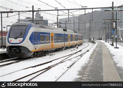 Train arriving at Central station in Amsterdam in winter