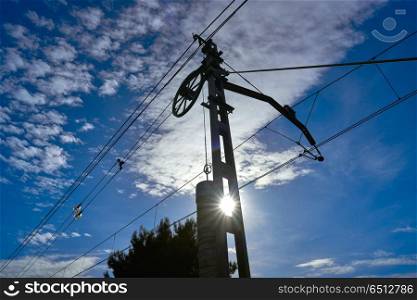 Train cables counterweight under blue sky . Train cables counterweight under blue sky backlight
