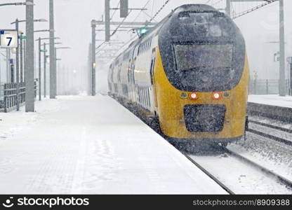 Train driving in snowstorm in winter in Amsterdam the Netherlands
