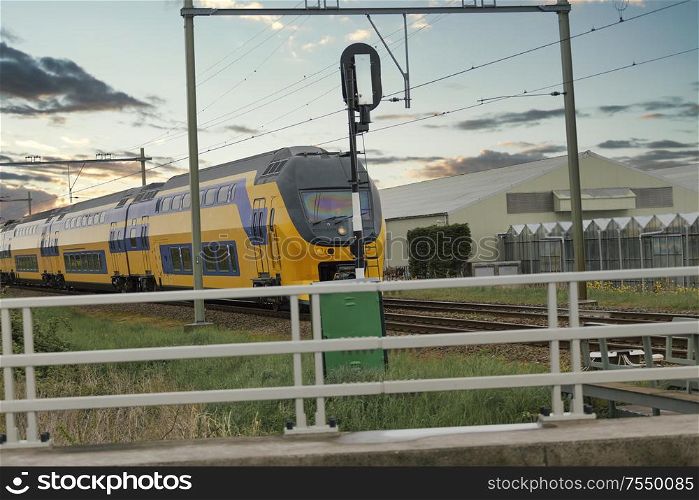 train in the Netherlands. Evening landscape