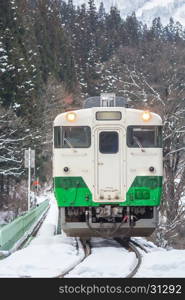 Train in Winter landscape snow on bridge