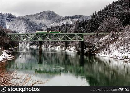 Train in Winter landscape snow on bridge panorama