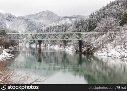 Train in Winter landscape snow on bridge panorama