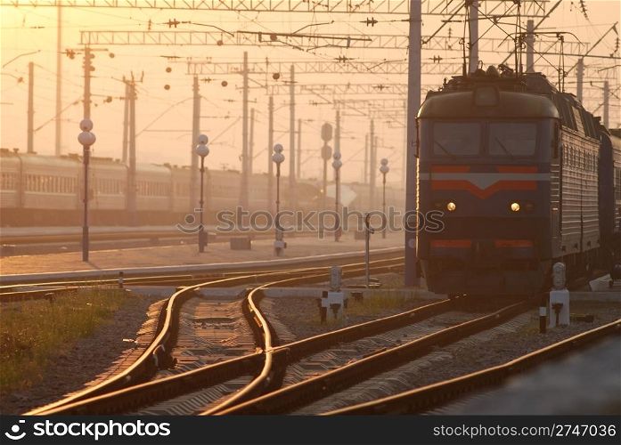 train on platform. Railroad. Sunrise