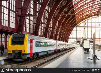 Train on railway station platform, travel in Europe. Transportation by european railroads, comfortable tourism and travelling