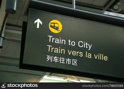 Train to city sign at airport