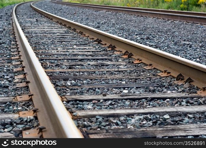 Train tracks. Vanishing twin railroad tracks in close up.