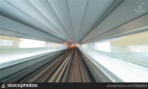 Train view. blurry speed motion on railway tunnel for futuristic network connection technology, digital data in computer concept. Abstract background at night time.