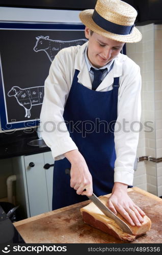 Trainee Butcher Preparing Sirloin Steak