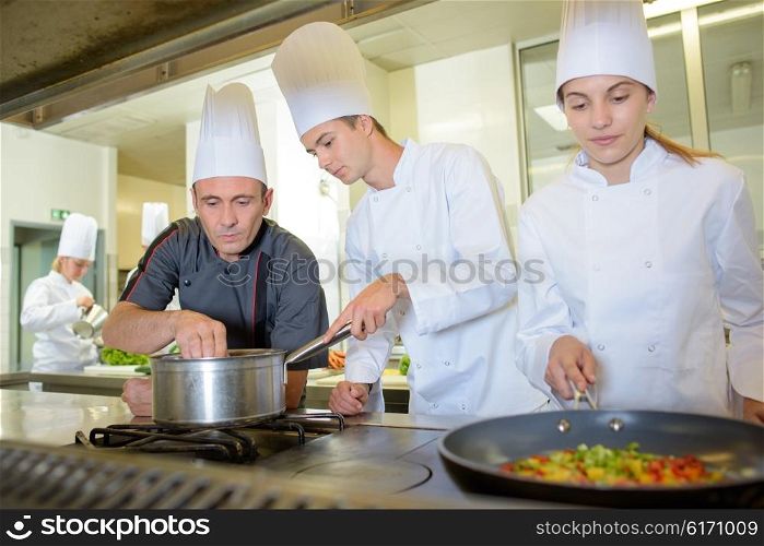 Trainee chefs, cooking