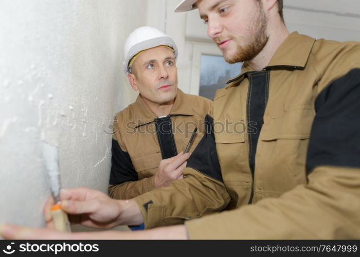 Trainee plasterer at work