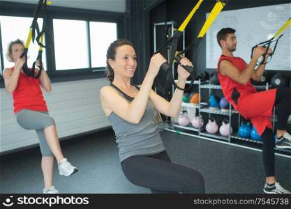 trainers doing exercises in their crossfit box