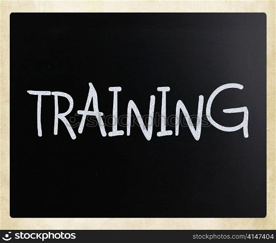 ""Training" handwritten with white chalk on a blackboard"