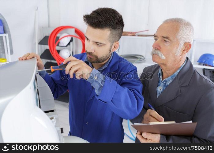 training male apprentice with teacher