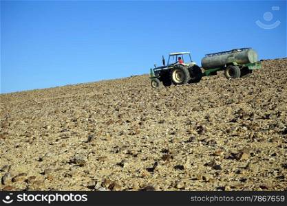 Traktor on the slope of mount in Negev desert, Israel