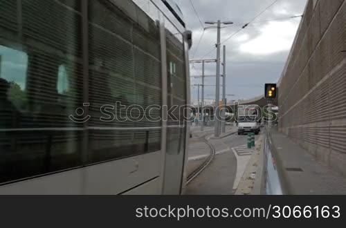 Tram is running away in Barcelona near the Glories metro station.