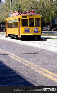 Tram moving in a city, Ybor City, Tampa, Florida, USA
