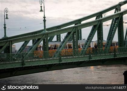 Tram on the Liberty bridge over the River Danube, Budapest